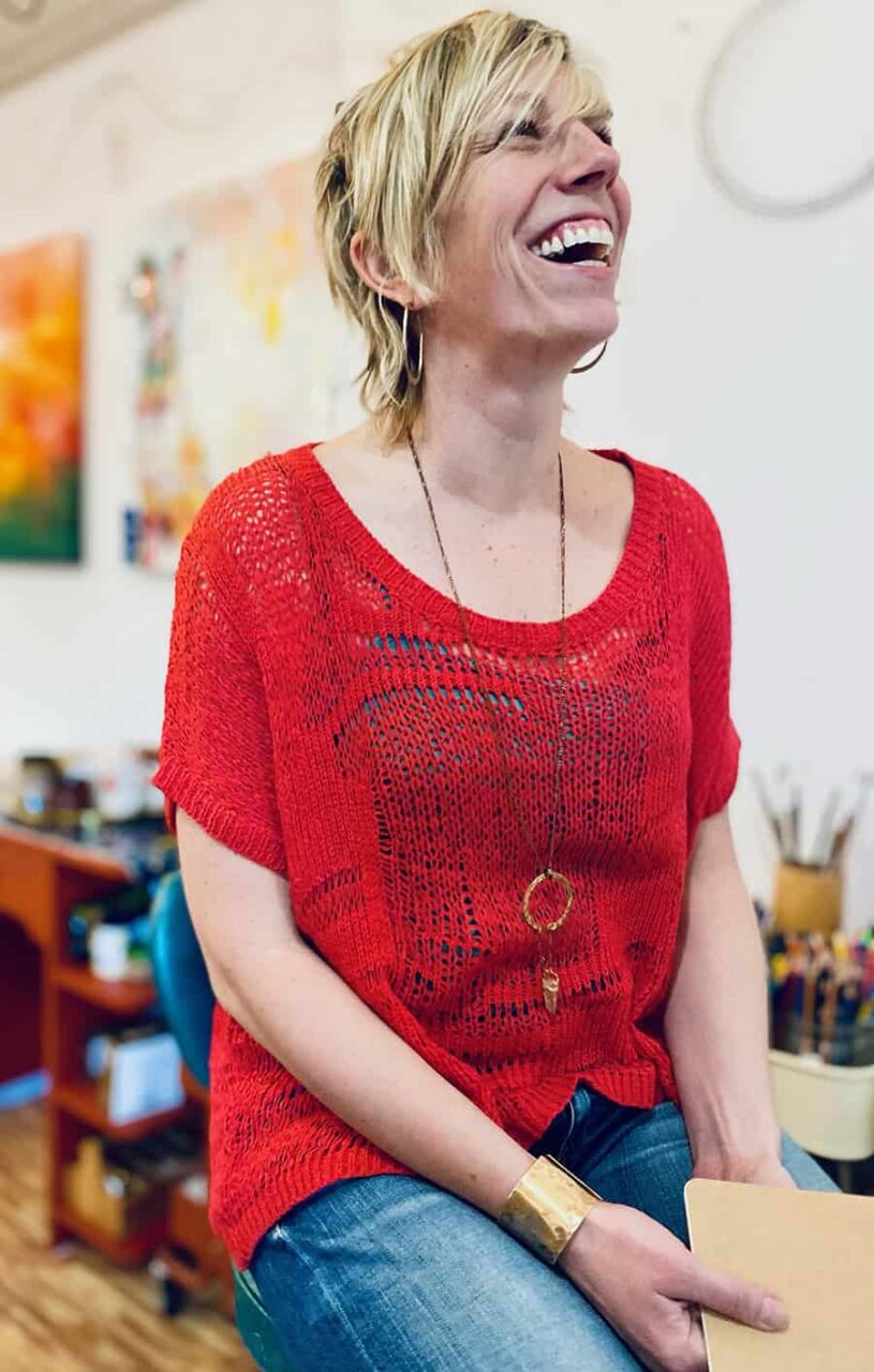 Kristin Boettger, Canadian Certified Counsellor and Registered Art Therapist in an art therapy space with art materials visible.